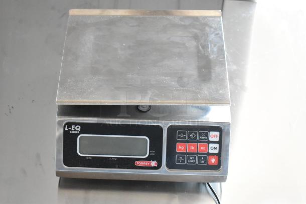 Torrey L-EQ Series digital scale with stainless steel platform, displays kg/lb/oz, used condition, functional keypad.