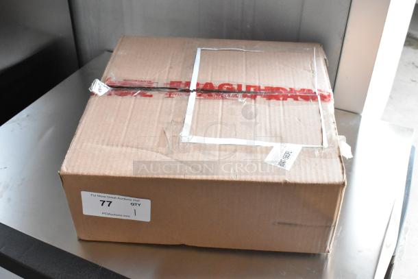 Cardboard box with red fragile tape, labeled "77 QTY 1" from PCI Auctions. Box has shipping tape, appears sealed.