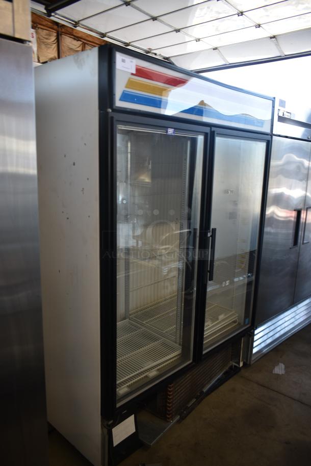 Commercial glass door refrigerator, dual-section, metal exterior, good condition, colorful paneling, small label visible.