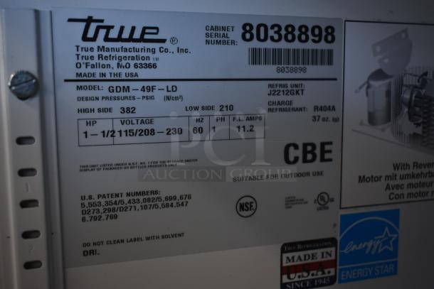 True Refrigeration label, Model GDM-49F-LD, 1-1/2 HP, 115/208-230V, R404A refrigerant, serial 8038898, NSF certified.