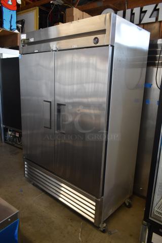 Stainless steel True commercial freezer, double doors, caster wheels, temperature gauge, gently used condition.