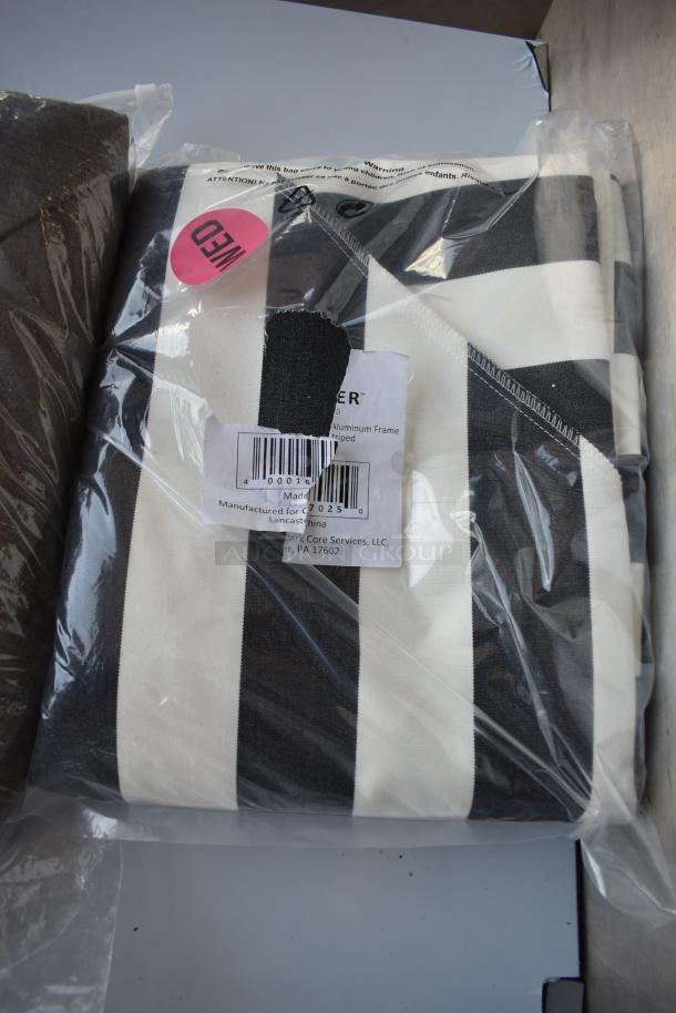 Black and white striped fabric in packaging; label shows model "7025," made in China by Landmark Core Services. "Weed" sticker visible.