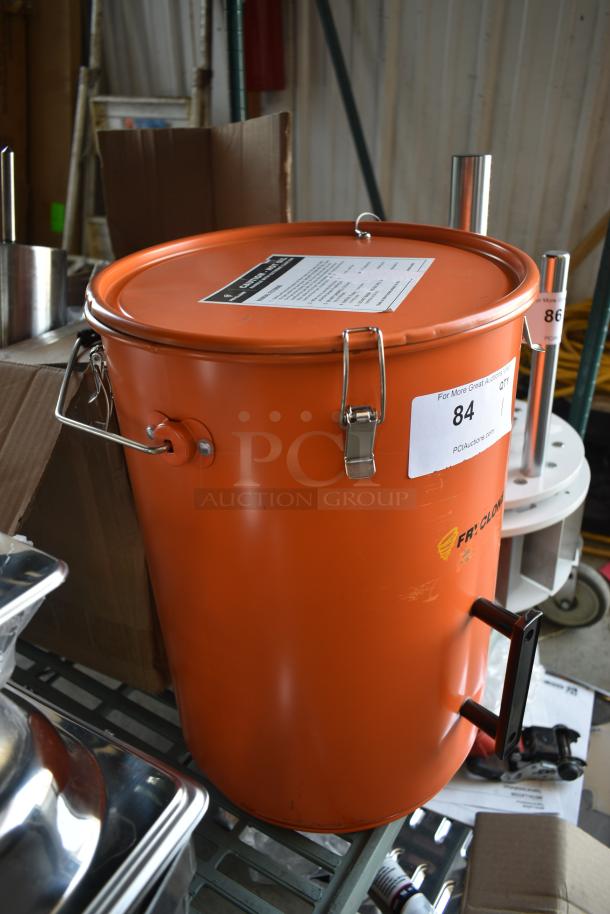 Orange Fry Clone vacuum tank with metal handles, sealed lid. Auction label "84" visible, indicating item number.