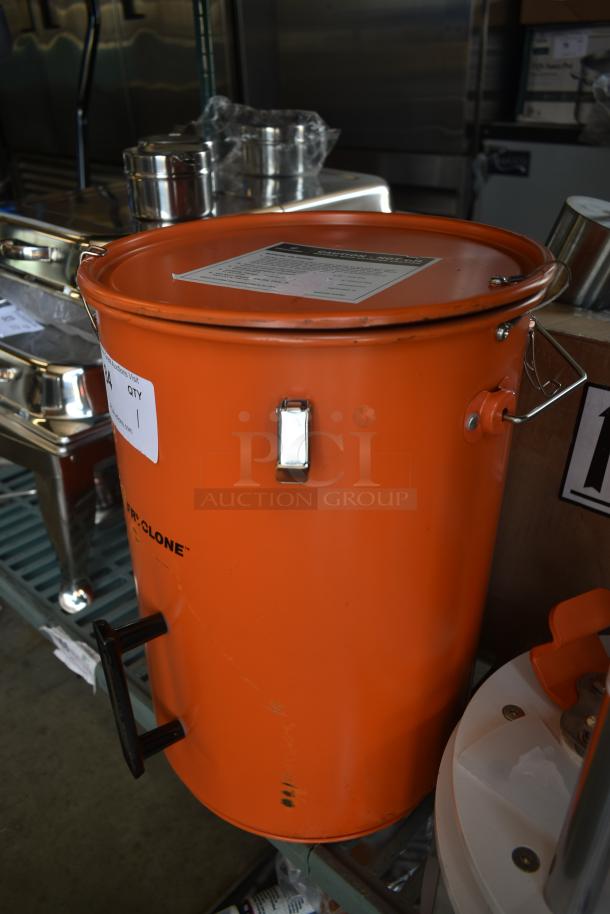 Orange Pro-Clone vacuum barrel with lid, visible latch, and handle. Label on side indicates quantity and item info. Good condition.