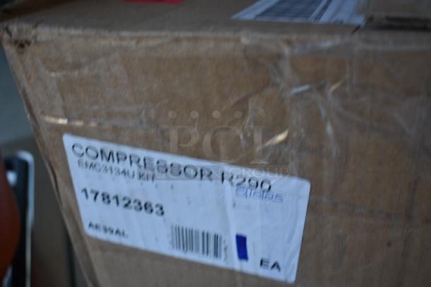 Cardboard box labeled "Compressor R290 EMC3134U Kit," serial number 17812363, indicating new condition.