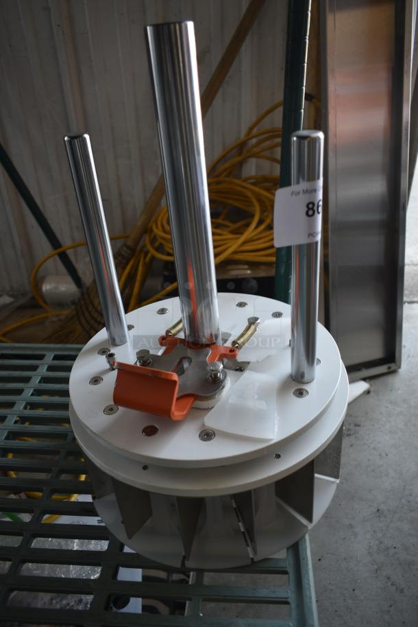 Industrial rotary device with three chrome rods and orange mounting bracket, on sale. Label reads "866". In good condition.