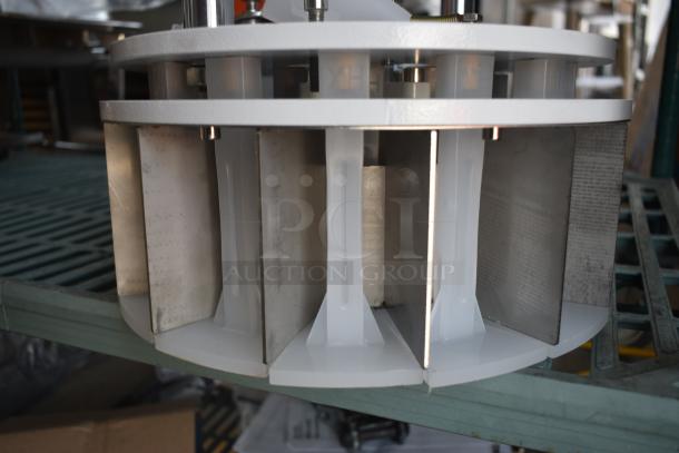 Industrial equipment component with metal blades and white plastic spacers, used condition, no visible markings or labels.