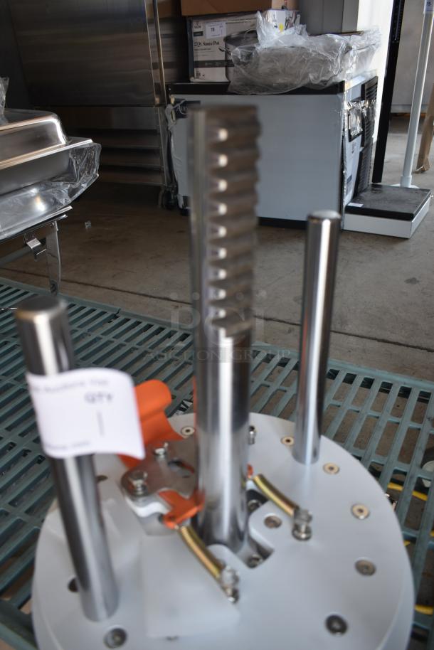 Industrial machine part with adjustable metal rods on a round base. Visible auction tag indicates quantity as one.