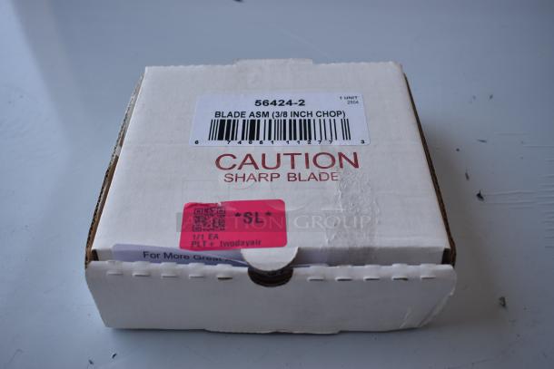 Box labeled "Blade ASM (3/8 Inch Chop)" with barcode and caution for sharp blade. White packaging in new condition.