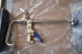 Chrome draft beer faucet, new condition, with a blue tap handle, visible threading, and securing nut.