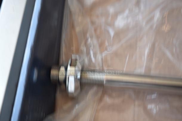 Metal rod with threaded end and hexagonal nut, new condition, wrapped in clear plastic.