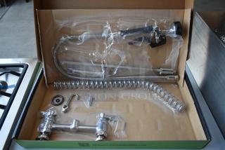 Commercial kitchen pre-rinse faucet kit, stainless steel, includes flexible hose, spray valve, mounting hardware. New in box.