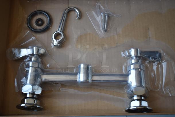 Dual handle chrome faucet set, new in box, includes installation hardware and gaskets, ideal for bathroom or kitchen use.