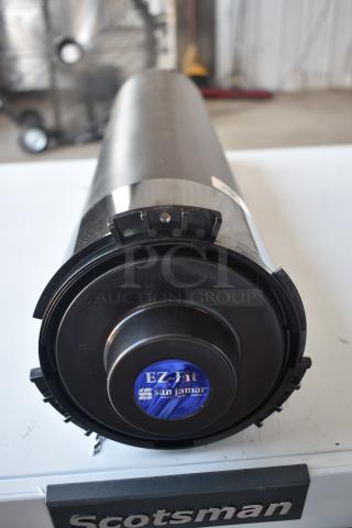 San Jamar EZ-Fit black cup dispenser, cylindrical, with visible label indicating brand and model, in good condition.