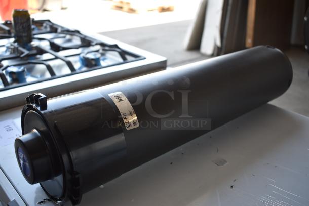 Black cylindrical filter cartridge with EZ-Fit label, NSF certified, in excellent condition, placed on a metal surface.