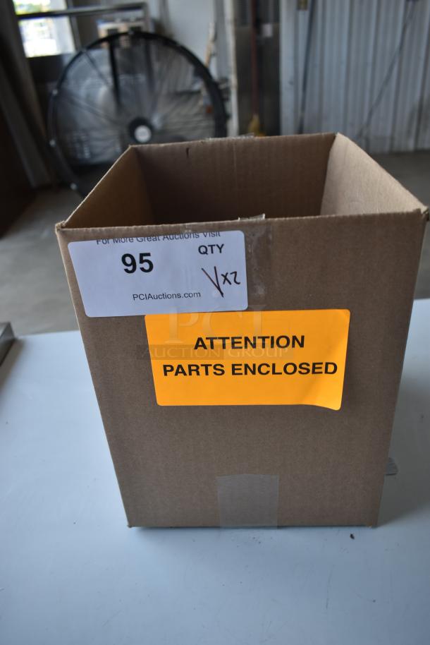 Cardboard box labeled "Attention Parts Enclosed" with auction tag displaying item number 95 and "Qty 1x2."