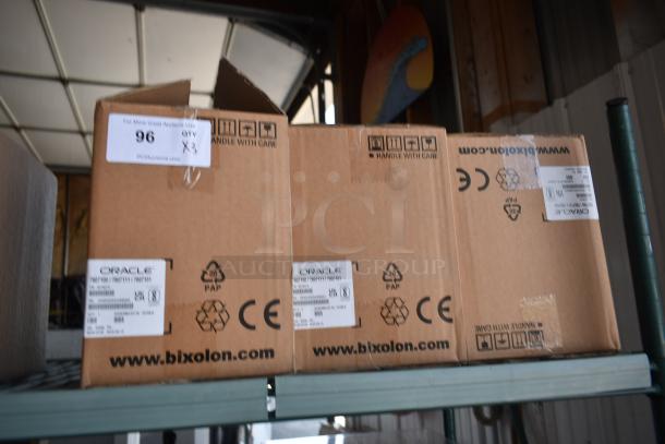 Three sealed Oracle printer boxes on a shelf, labeled "www.bixolon.com," with handling symbols and CE mark.