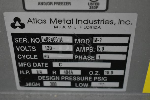 Atlas Metal Industries label showing Model RM-2, Serial 14084651A, 120 volts, 6 amps, phase 1, R-404A refrigerant.