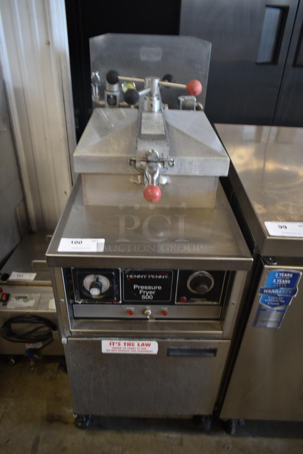 Henny Penny Pressure Fryer 500, stainless steel, used condition, control dials, safety label visible, on caster wheels.