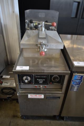 Henny Penny Pressure Fryer 500, stainless steel, used condition, control dials, safety label visible, on caster wheels.