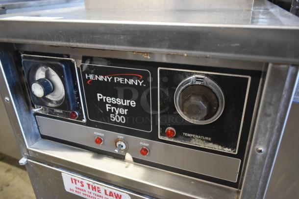 Henny Penny Pressure Fryer 500, features timer, temperature dial, and control switches, some wear visible.