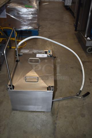 Stainless steel industrial fluid dispenser, with hose and handle, in used condition. Labels include "AID" and "LOL".