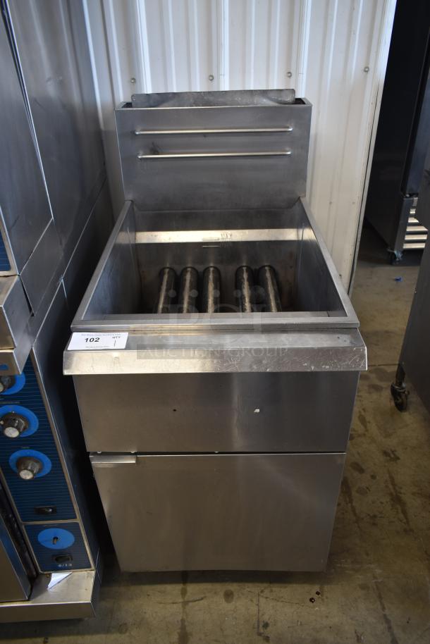 Commercial stainless steel charbroiler with roller grates, moderate wear, auction lot tag 102 attached.