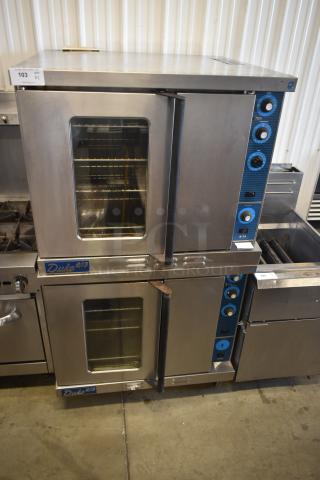 Duke 6/13 double convection oven, stainless steel, dual glass doors, manual controls, good condition, auction tag visible.