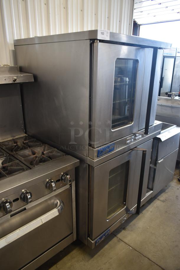 Commercial double stack Duke convection ovens with glass doors, stainless steel, used condition. Visible label "Duke 62G".