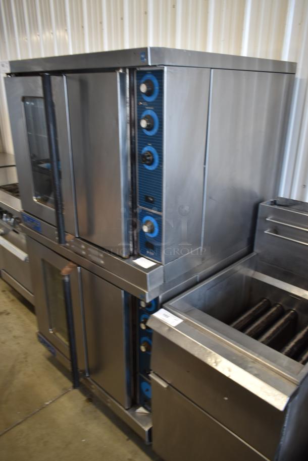 Commercial stainless steel double stack convection ovens with blue control panels, in good used condition. Auction lot number visible.