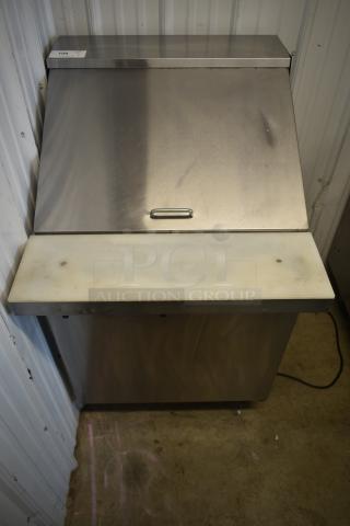 Stainless steel commercial ice bin, top lid, and handle, with cutting board attached. Auction tag labeled "106."