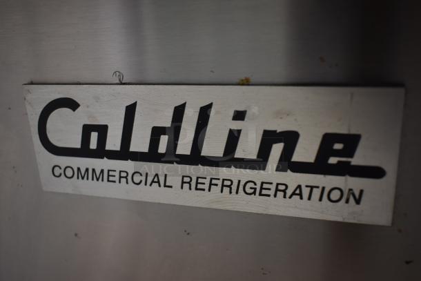 Coldline commercial refrigerator label, signifying brand and type. Sign on stainless steel surface, minor wear visible.