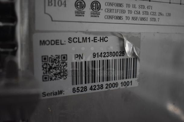 Label on equipment showing Model SCLM1-E-HC, PN 9142380025, Serial# 6528 4238 2009 1001, conforms to UL, CSA, NSF/ANSI standards.