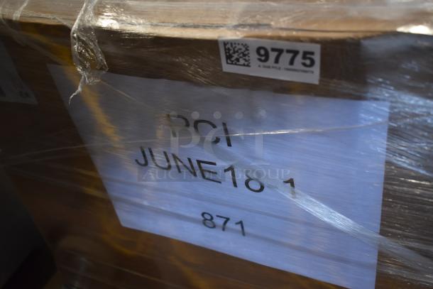 Wooden crate wrapped in plastic, labeled "PCI JUNE 18 1 871," with a barcode and number "9775."