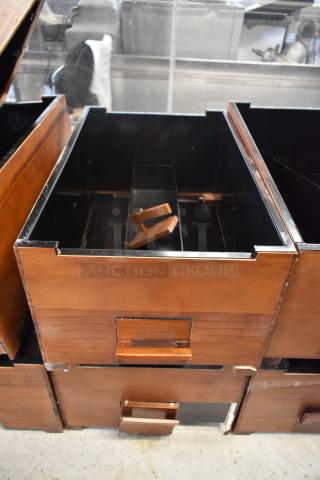 Wooden drawers with metal lining and handles, modular design, showing moderate wear; ideal for organizing or storage.