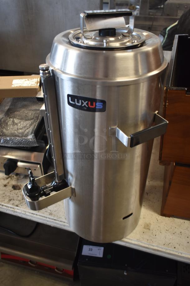 Luxus stainless steel commercial coffee dispenser, with spout and sturdy handles. In good condition.
