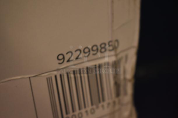 Close-up of a barcode on a cardboard box, with the number 92299850 visible above. The box shows signs of wear.