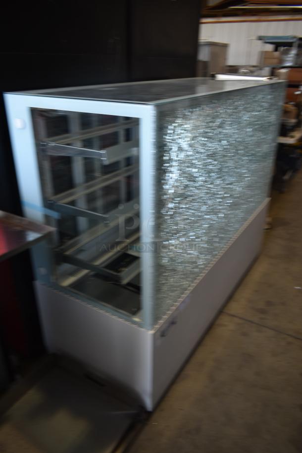 Commercial display refrigerator, glass front, and side panel with textured glass. Used condition, metal frame.