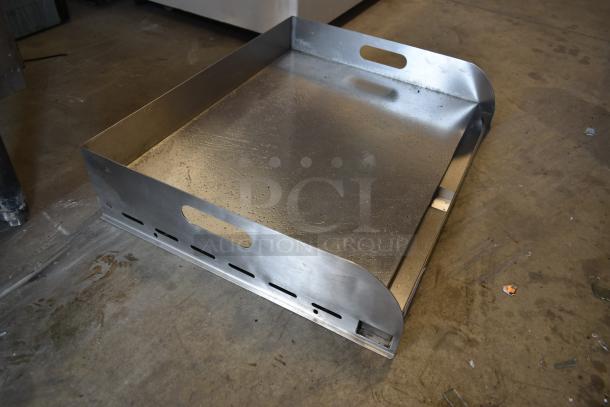 Stainless steel griddle, commercial-grade, with side handles and grease drain, lightly used condition, suitable for industrial kitchens.
