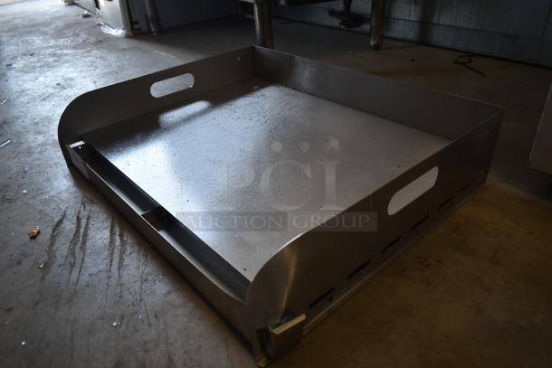 Large industrial metal tray, stainless steel, with handles, in good condition. Some surface marks visible.