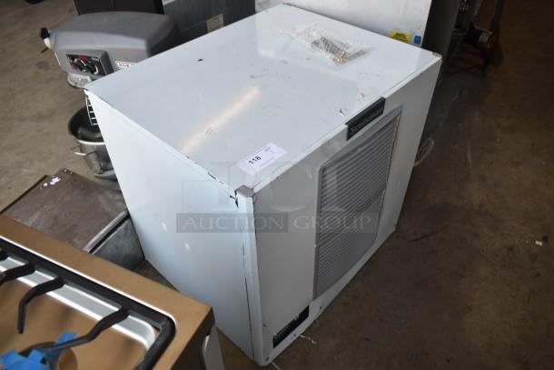 Scotsman commercial ice machine, white, used condition with visible wear, label "118" on top, includes bubble-wrapped parts.