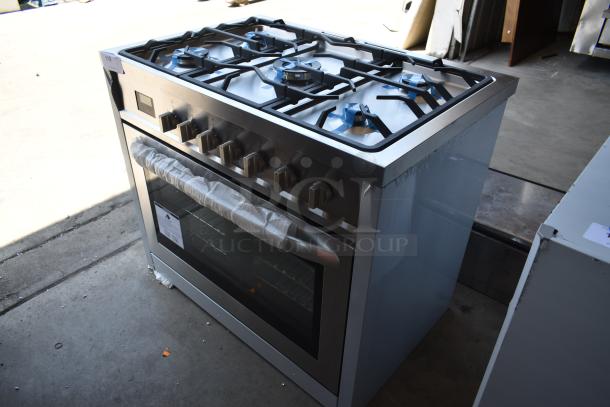 Stainless steel gas range with oven, six burners, transparent door, protective wrapping, and auction label number 118.