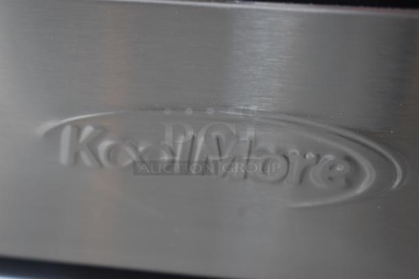 Silver KoolMore appliance with engraved logo, showcasing a sleek stainless steel finish, in excellent condition.