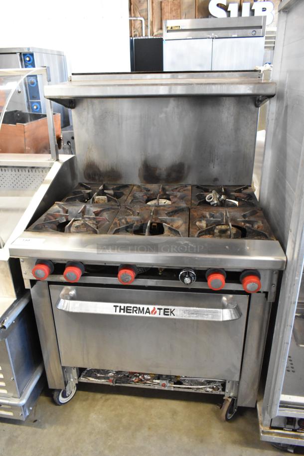 Thermatek Stainless Steel Commercial Gas Powered 6 Burner Range w/ Oven, Over Shelf and Back Splash on Commercial Casters. - Image 1 of 9