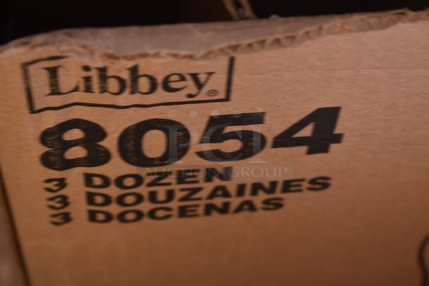18 BRAND NEW SCRATCH AND DENT! Items Including 3 Box 5535009SC Acopa Lore 8 oz. Flute Glass - 12/Case, Libbey 917CD Heavy Base 11 oz. Customizable Rocks / Old Fashioned Glass - 36/Case, 266 Libbey 20 oz. Can Glass - 12/Case, 160BSTROFLWH Choice White Poly-Cotton Full-Length Bistro Apron with 2 Pockets - 38" x 34", Choice 42 oz. Black Round Microwavable Heavy Weight Bowl with Lid - 150/Case 129MCB42B, Libbey 8054 Georgian 6 oz. Irish Coffee Glass - 36/Case, 5530512 Acopa 8 oz. Footed Martini / Dessert Glass - 12/Case. 18 Times Your Bid! - Image 12 of 15