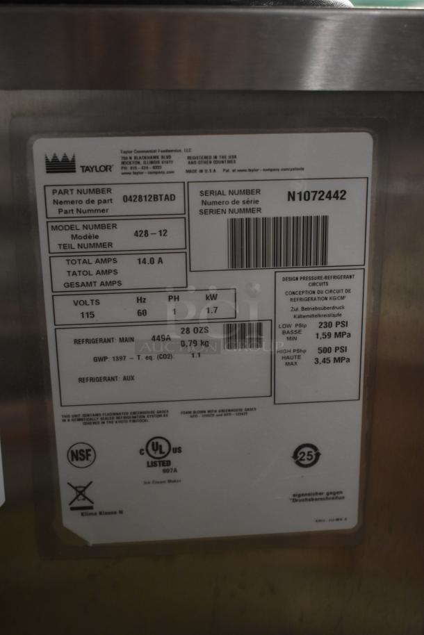 Taylor ice cream maker label displaying part number 042812BTAD, model 428-12, serial N1072442, 14.0A, 115V, uses 449A refrigerant.