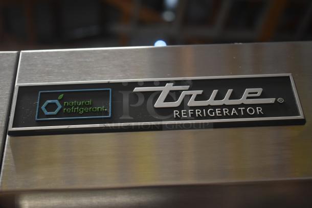 True refrigerator with natural refrigerant label, stainless steel finish, energy-efficient and eco-friendly design.