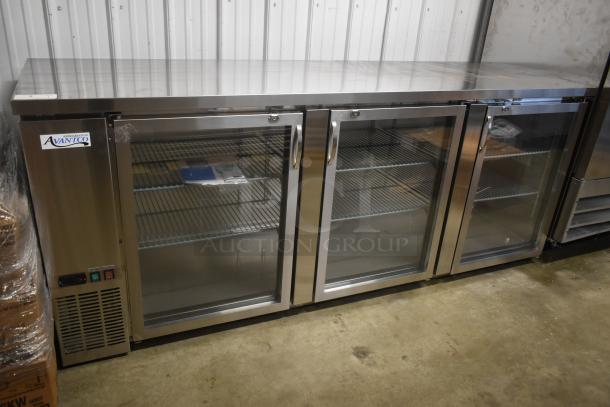 Avantco three-door commercial glass-front refrigerator, stainless steel, new condition, with label indicating model and temperature controls.