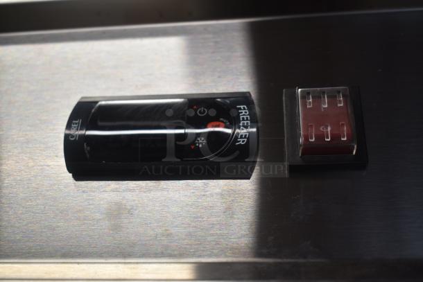 CAREL freezer control panel on stainless steel surface, featuring digital display and red button. Excellent condition.