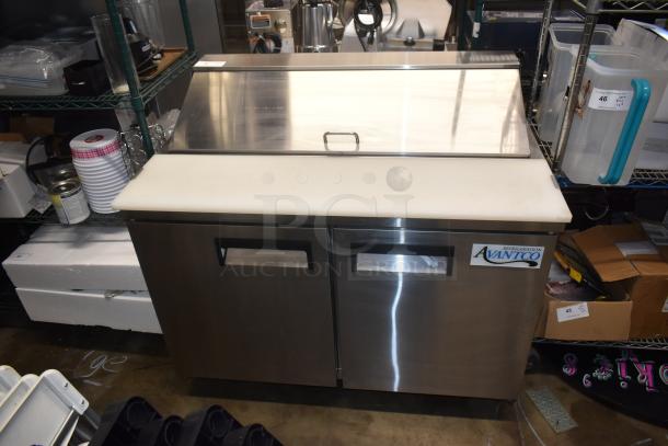 Avanco refrigeration prep table with stainless steel exterior and dual doors, in good condition, ideal for commercial kitchens.